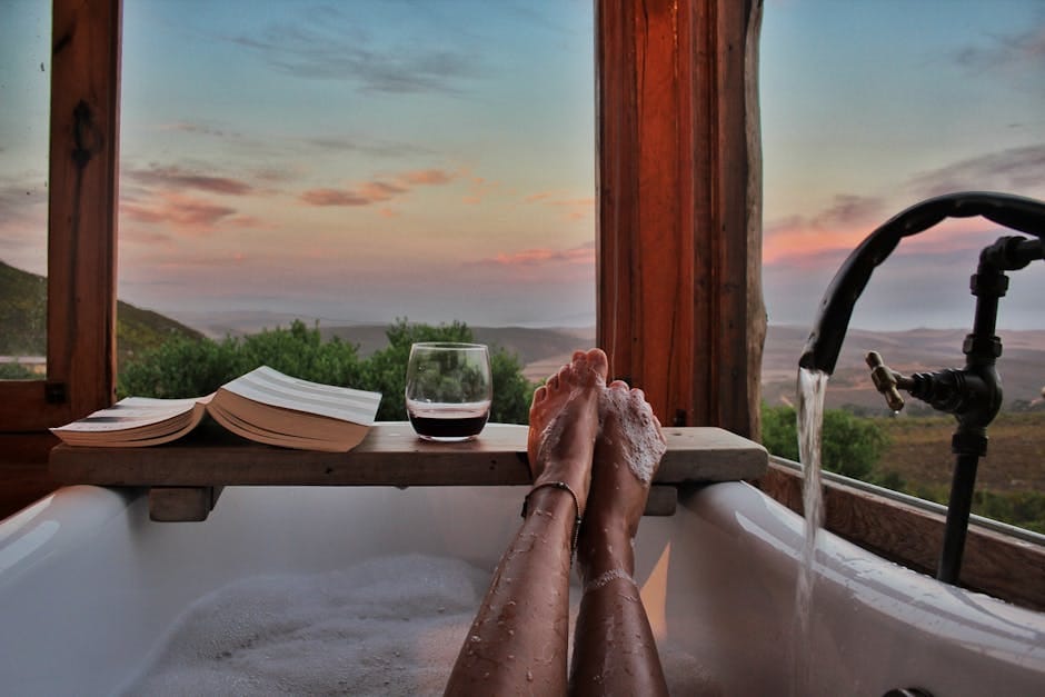 Enjoying a soothing bath with a view, perfect for relaxation and self-care.