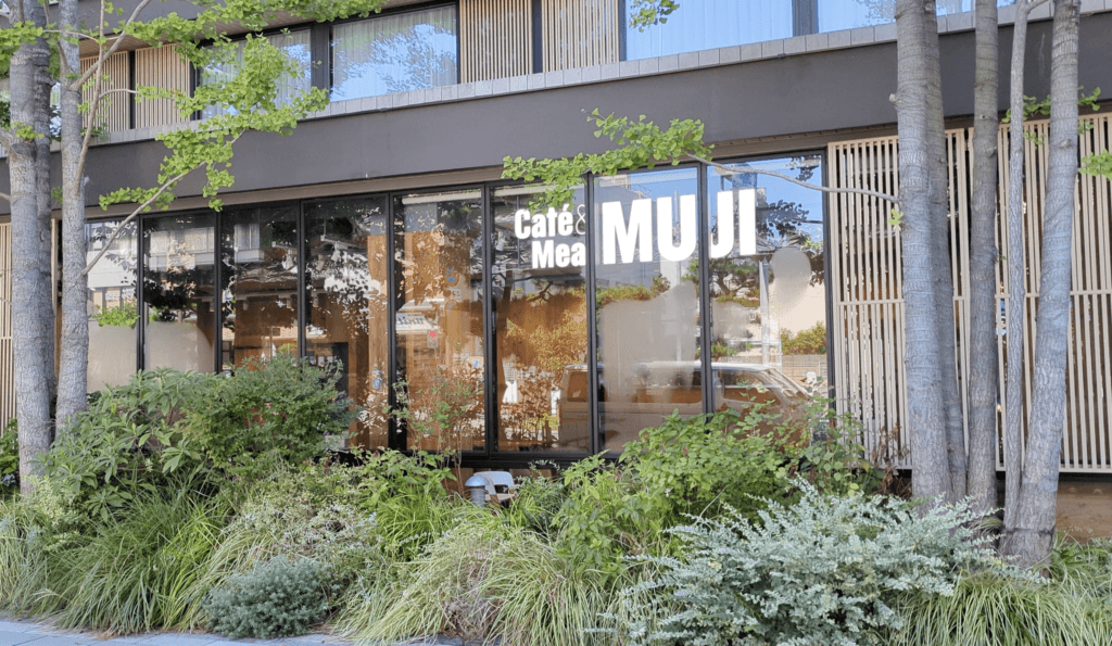 Café & Meal MUJI located inside Hotel Metropolitan Kamakura, with simple wooden tables and a calming atmosphere for breakfast or meals